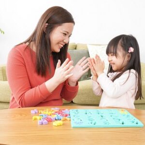 Therapist and child with ASD playing